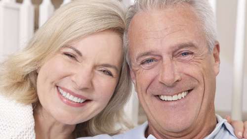 older couple with bright white smiles in columbia md